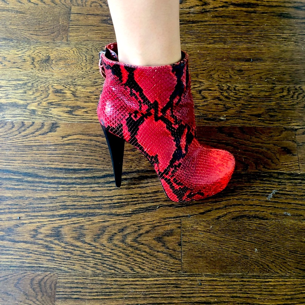 Ankle boots on red and black snake print